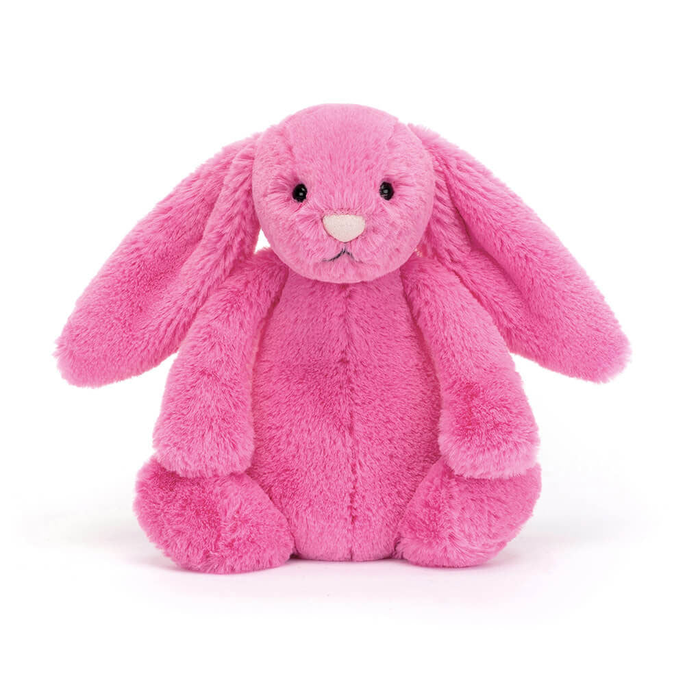 A soft, hot pink stuffed bunny toy with a round nose and big eyes, made of plush fabric.