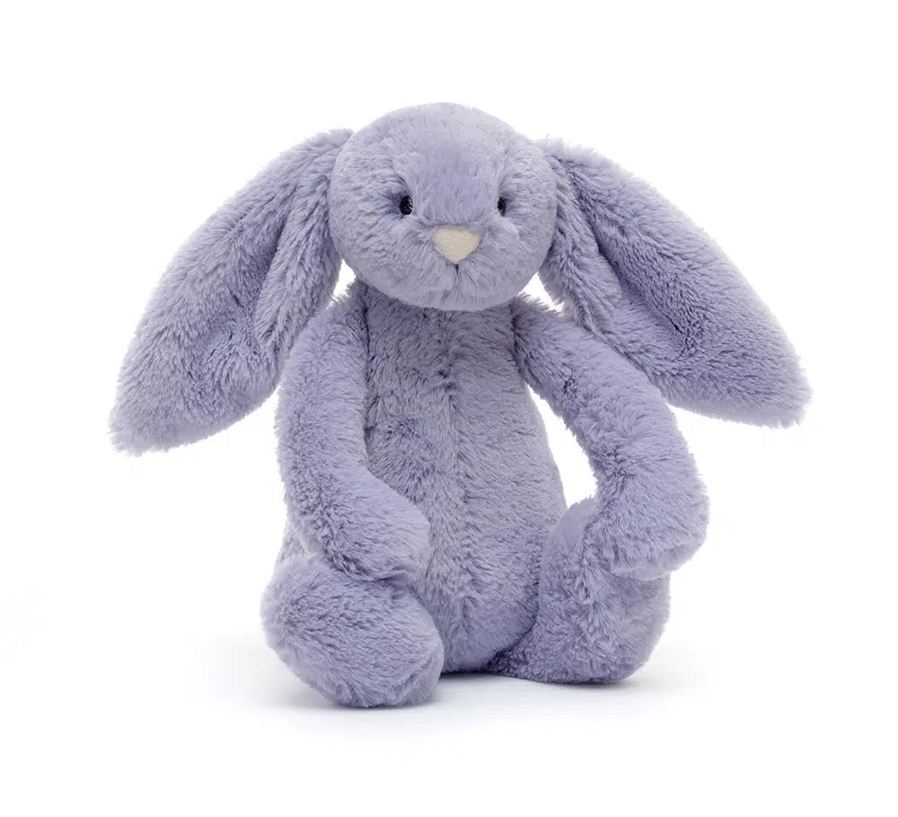 A small plush toy in the form of a violet-colored bunny with a pink nose and floppy ears.