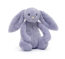 A small plush toy in the form of a violet-colored bunny with a pink nose and floppy ears.