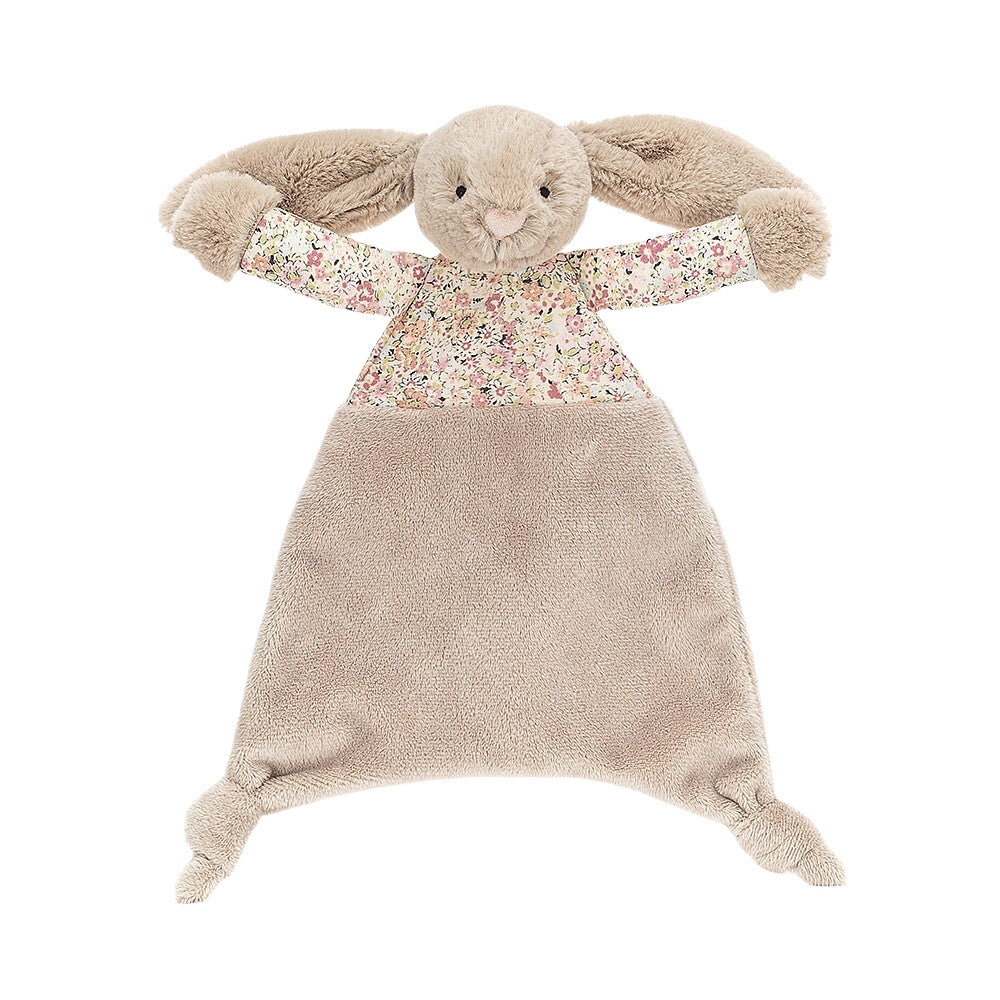 A beige plush toy in the shape of a bunny with a flower-print top and a silky tum.