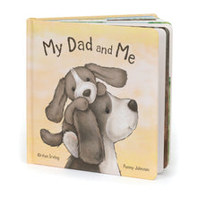 A book titled 'MY DAD AND ME' featuring an illustration of a puppy and a teddy bear on the cover, signifying the theme of a father and child relationship.