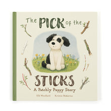 Hardcover book cover of 'The Pick of the Sticks' featuring an illustration of a black and white puppy sitting among sticks and flowers.