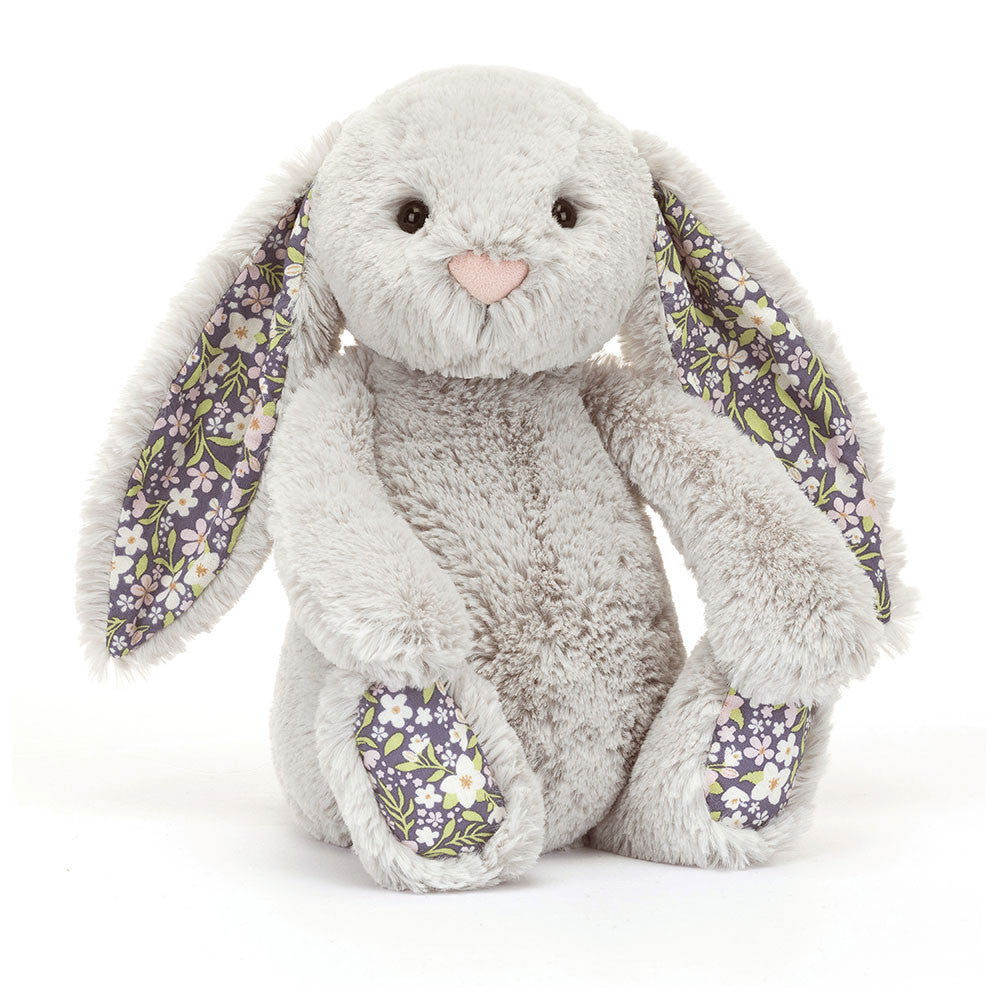 A plush toy depicting a silver bunny with floral ears and feet, against a white background.