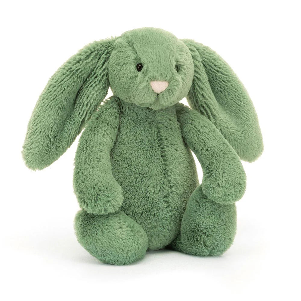 A soft green plush toy resembling a bunny with long ears, a pink nose, and chunky paws.