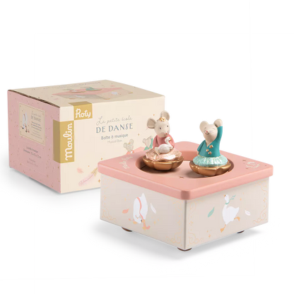 A pastel pink and cream music box with two dancing mouse figurines, shown alongside its branded retail box on a clean white background.