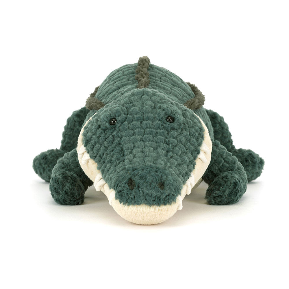 Plush toy alligator on a white background