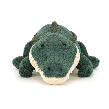 Plush toy alligator on a white background