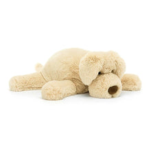 A beige plush toy dog with floppy ears and a waggy tail, designed for cuddling.