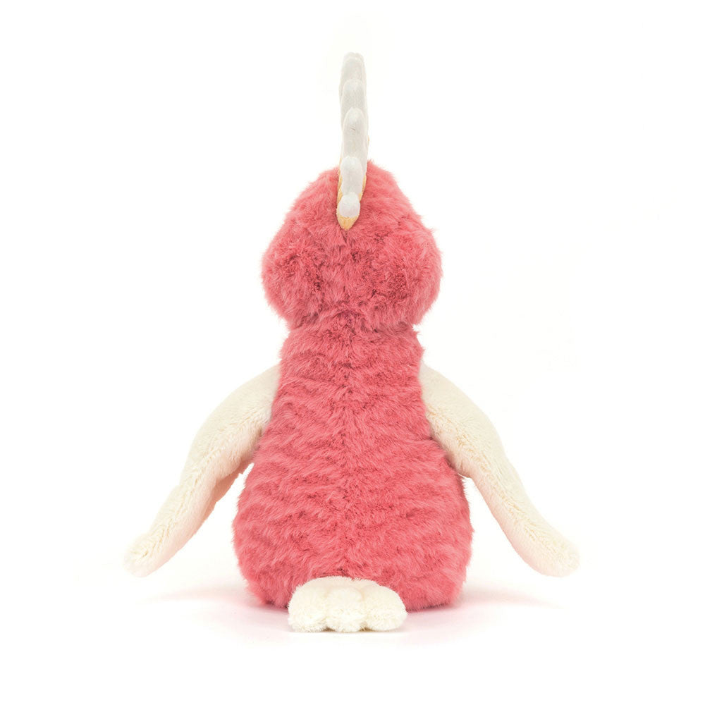 Plush toy with a pink body and white wings on a white background