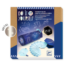 Packaging for a DIY Constellation Viewer kit by Djeco, featuring images of the assembled product, punch cards, and components like a wooden ring and hole punch.