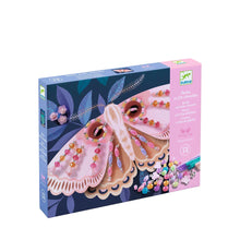 Boxed craft kit with butterfly design and colorful beads on a white background