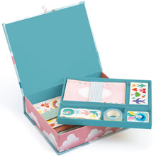 A box set of children's stationery with pink and blue cloud design, including various cards and envelopes with decorative elements.