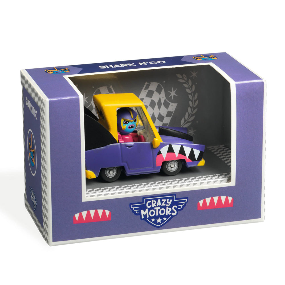 A toy car with a shark design, predominantly purple, with a yellow roof, packaged in a box labeled 'Shark N Go, Crazy Motors'.