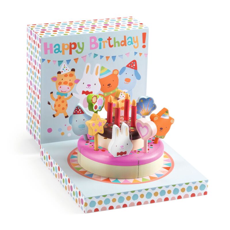 Children's birthday cake toy with candles and animals in a colorful box