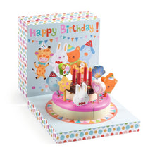 Children's birthday cake toy with candles and animals in a colorful box