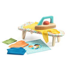 Children's play kitchen set with a table, chairs, and various accessories on a white background