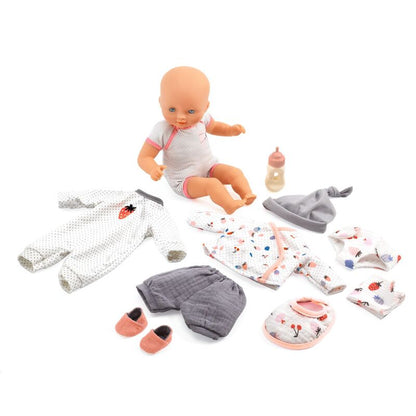 Baby doll with clothing and accessories on a white background