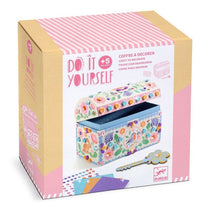 Decorative box packaging with floral design and 'Do It Yourself' text on a white background