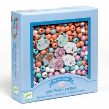 A box of wooden beads with various pastel colors and designs, including rainbows and kittens.