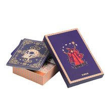A box of Magic Card Tricks Set open to display the contents with ornate designs on the cards.