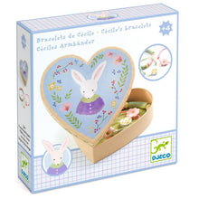 Heart-shaped jewelry box with rabbit design on a white background