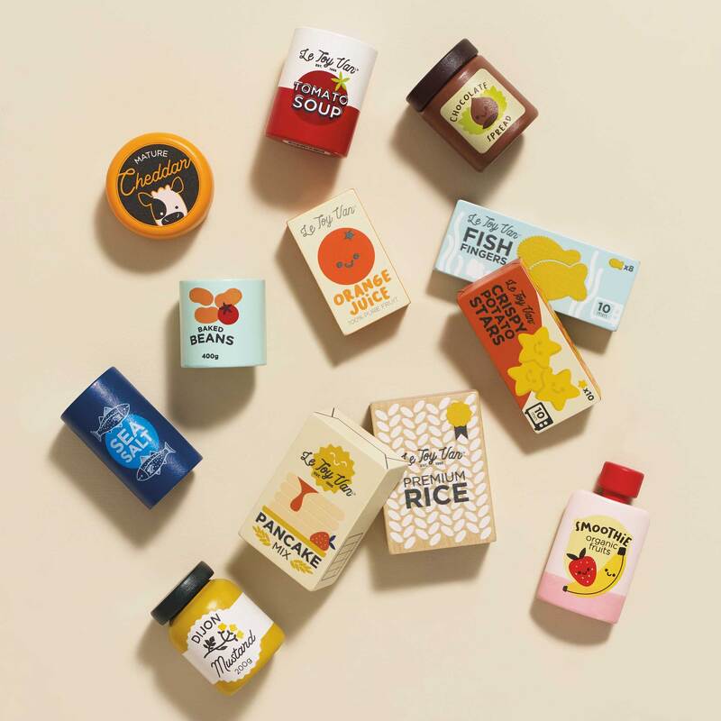 Assorted wooden food packaging on a beige background