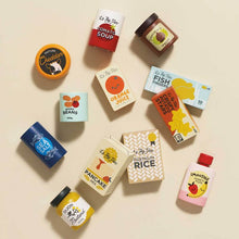 Assorted wooden food packaging on a beige background