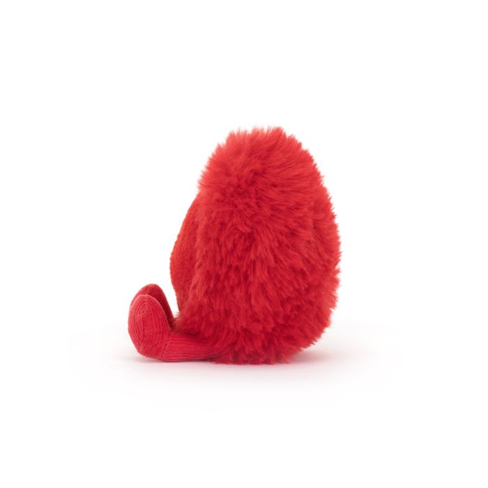 Fluffy red soft toy made by Jellycat in the shape of a heart. The heart has red plush legs.