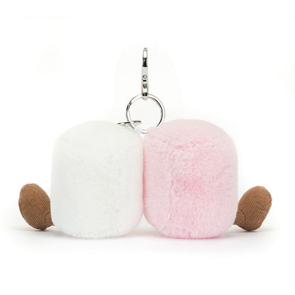 White and pink marshmallow plushies with brown feet, sitting