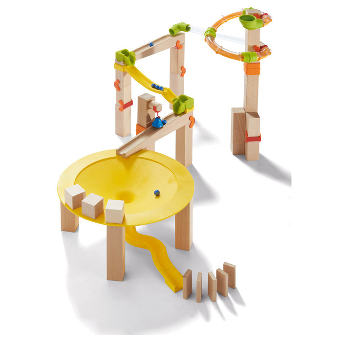 Wooden marble run construction set with late yellow funnel feature