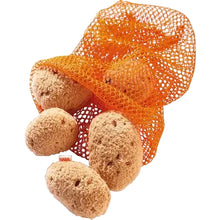 Set of fabric potatoes in orange mesh bag on a white background