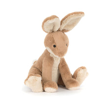 A plush toy in the form of a hare with biscuit fur, oatmeal tummy and paws, and a flat cream tail.