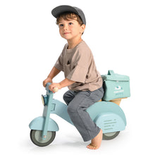 Child riding a light blue scooter with a small bag on a white background