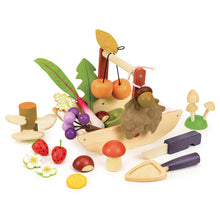 Wooden toy set with fruits, vegetables, and a wooden trug on a white background