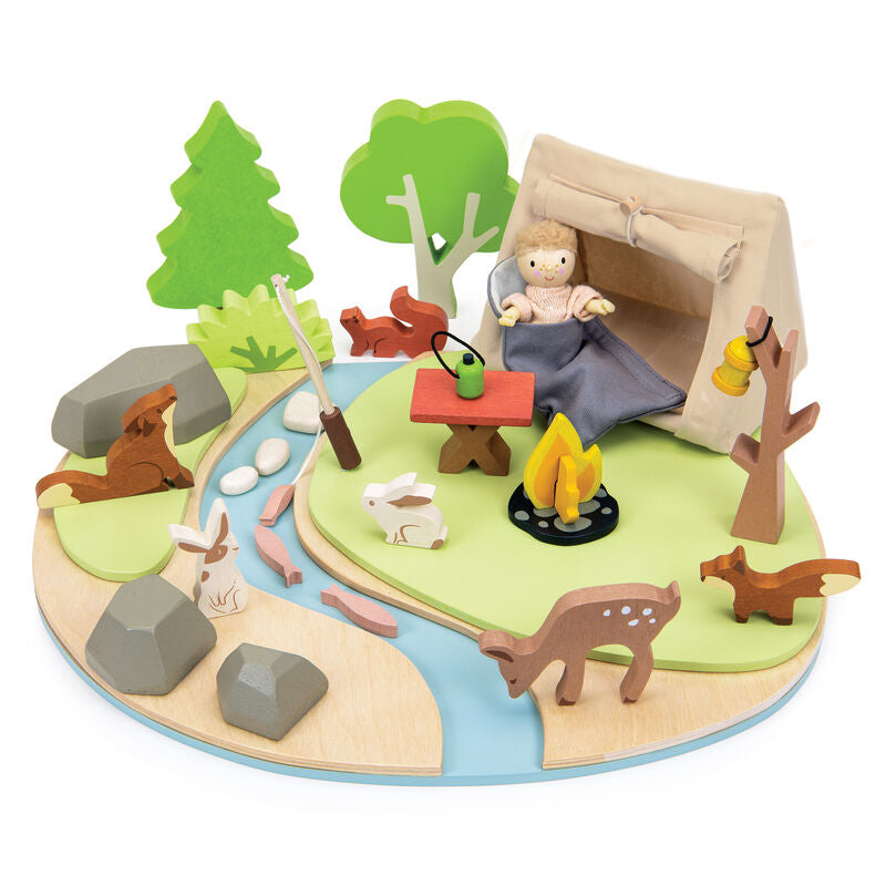 Wooden playset with a wooden child doll  in a tent, animals, and nature elements on a white background