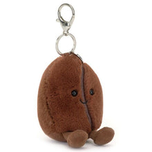 Plush keychain shaped like a coffee bean on a white background