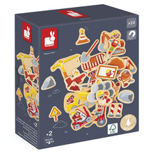 Box of Janod wooden toy with construction-themed magnetic pieces on a white background