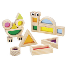 Set of wooden block shapes with colorful translucent window feature,  on a white background