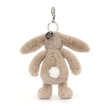 Plush bunny keychain with a white  bob tail on a white background