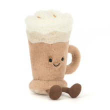 Plush toy resembling an iced coffee with a smiling face on a white background
