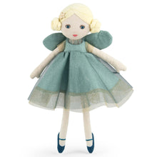 Stuffed doll with a green dress on a white background