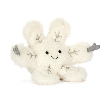 White plush snow flake toy with silver accents on a white background