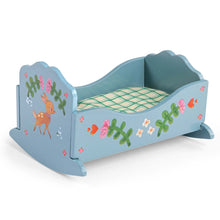 Decorative blue crib with floral and animal designs on a white background