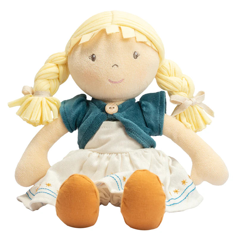 Plush doll with blonde hair, blue sweater, and white dress on a white background