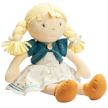 Plush doll with blonde hair, blue sweater, and white dress on a white background
