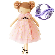 Doll in a pink dress with gold stars, wearing a headband with pom-poms, on a white background with 'Oprah's Favorite Things' label.