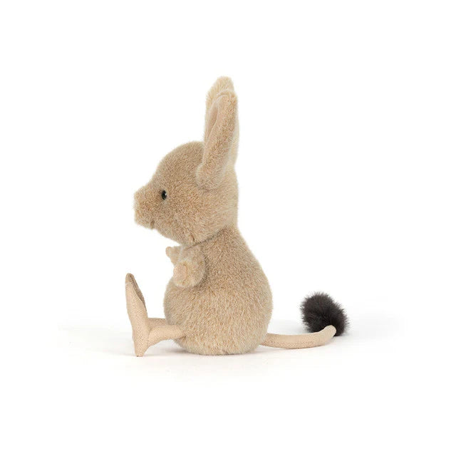 Stuffed animal mouse sitting on a white background
