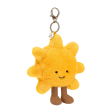 Jellycat Plush sun-shaped keychain with a smiling face on a white background