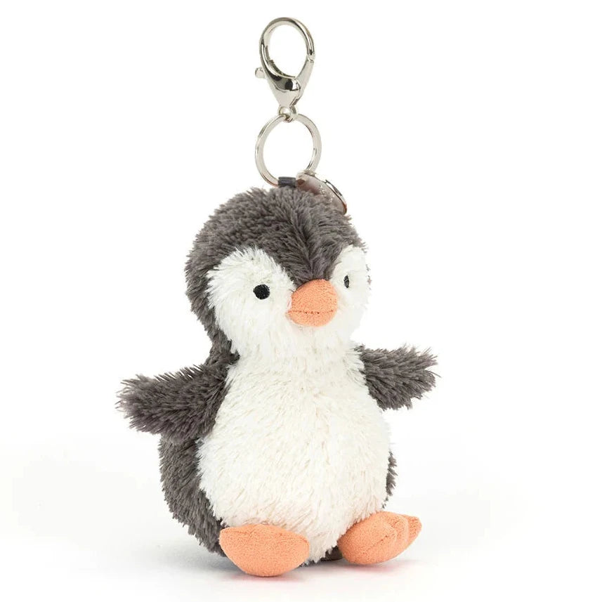 Plush penguin keychain with a white background