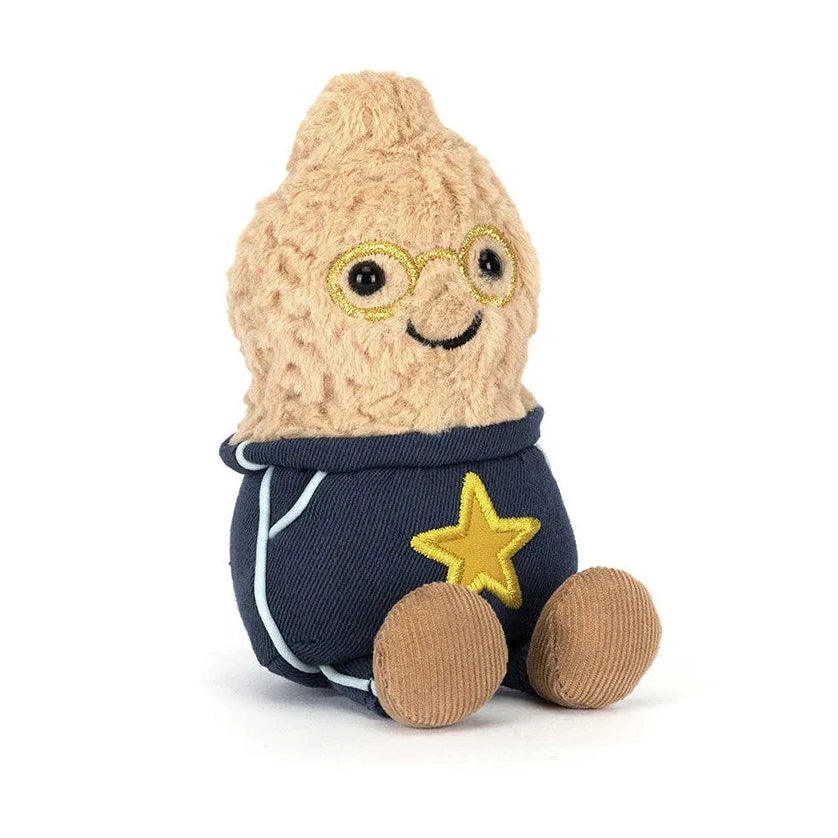 Plush toy resembling a peanut character wearing navy outfit with a goldstar on a white background